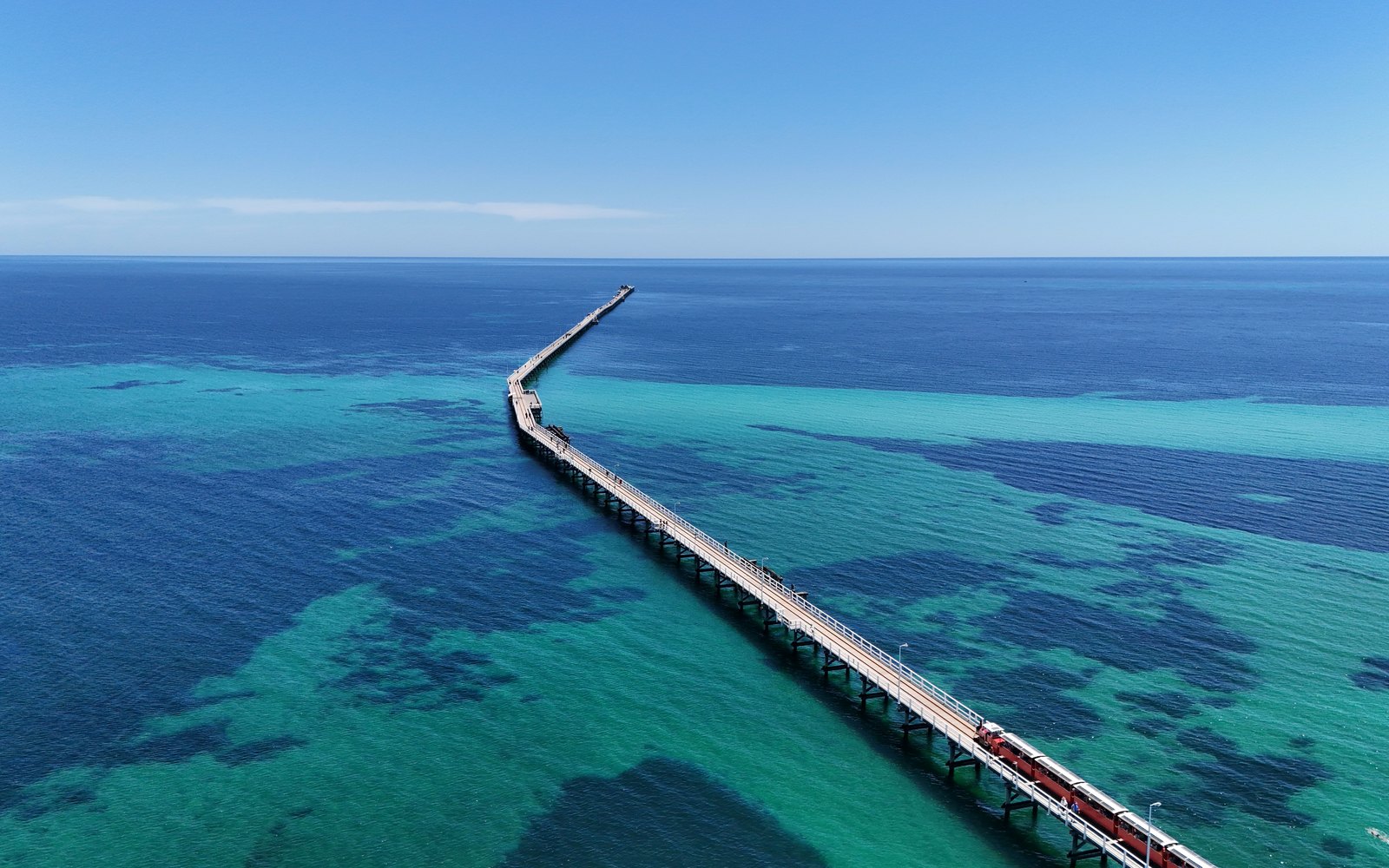 Aerial photograph of Busselton Jetty extending over turquoise water