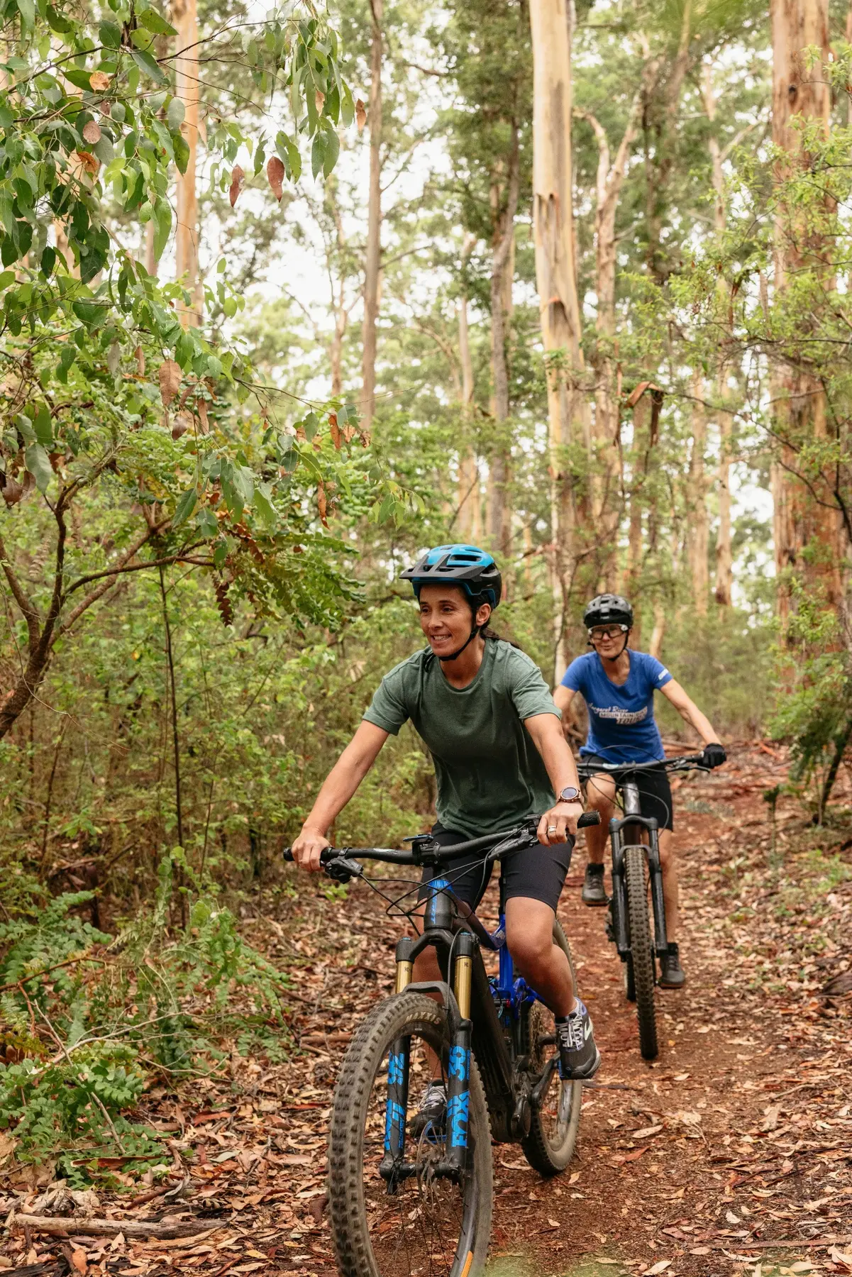 Mountain bikers riding through forest in the Margaret River region
